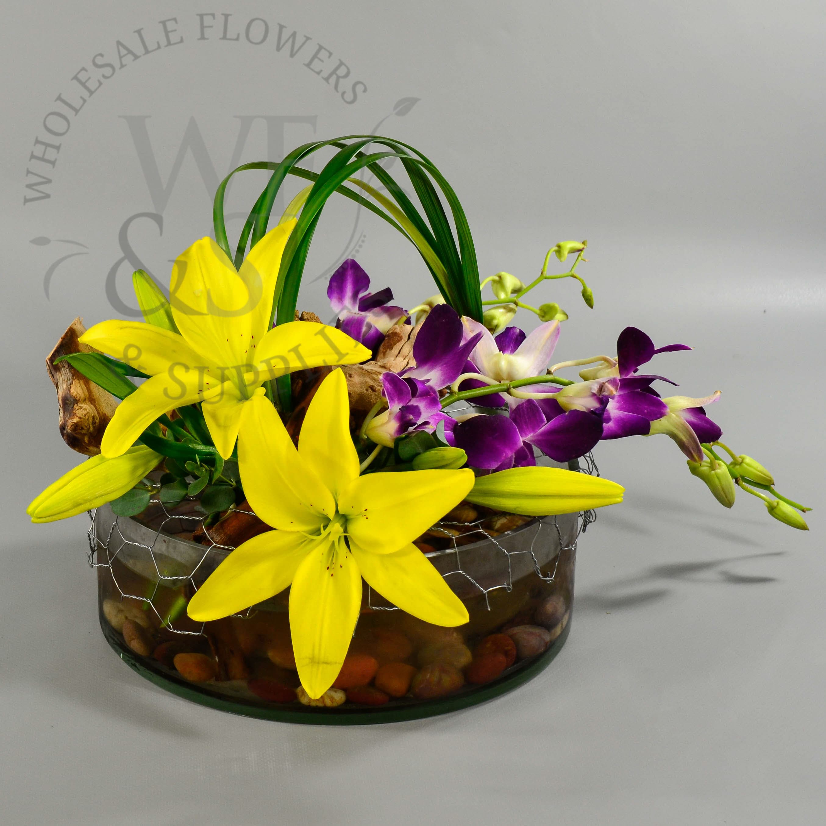 Lilies and Orchids in a Round Glass Dish Garden