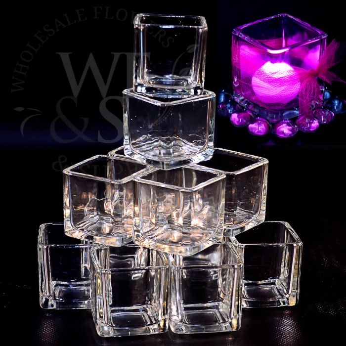 https://www.wholesaleflowersandsupplies.com/media/catalog/product/cache/8c06bbe7783191aa59a1c277c657da02/2/-/2-square-glass-votive-candle-holder-clear-729-1.jpg